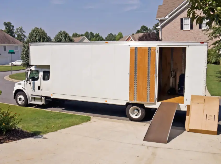 What should businesses consider when selecting a long-distance moving company for relocations?