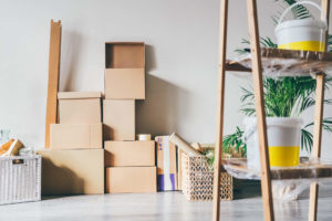 Belongings packed in cardboard boxes from moving long distance to a new home