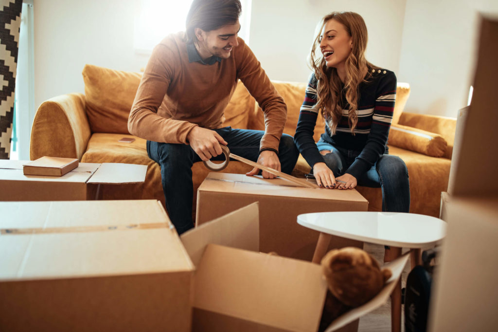 A couple preparing to move during summer